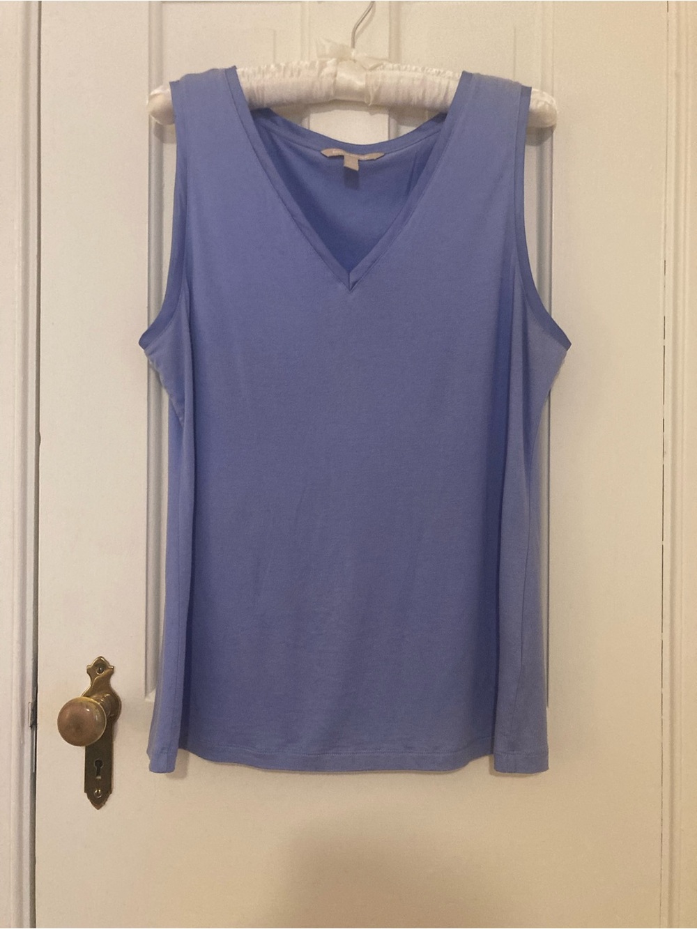 Soft blue sleeveless V-neck top
